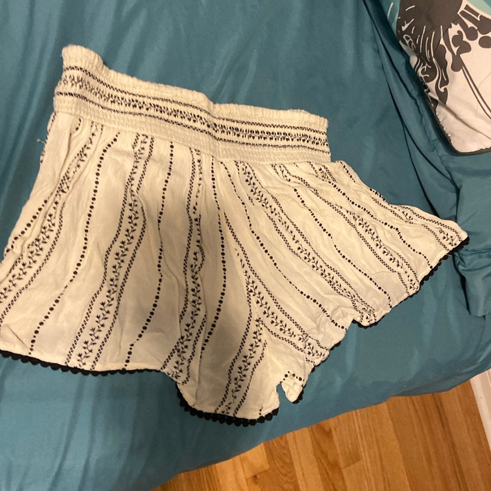 White patterned flowy shorts
